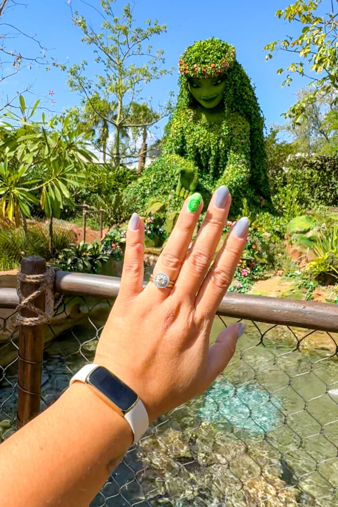 Moana Disney nails held up to topiary