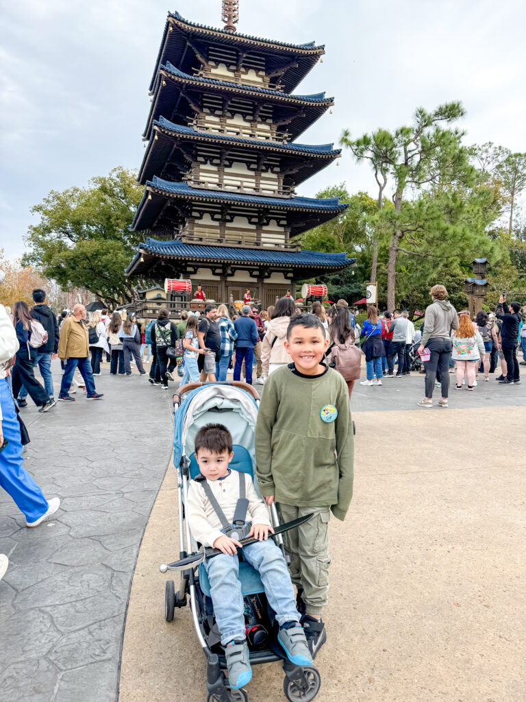 Pushing a stroller through Disney’s Epcot park near the Japan pavilion