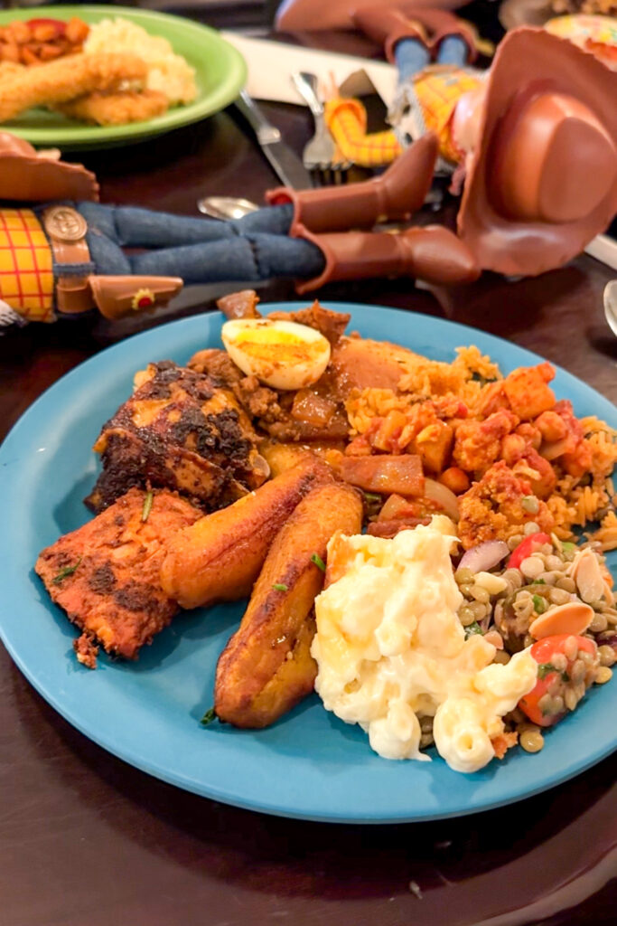 Plate of Tusker House food featuring chicken, rice, and vegetables served buffet-style.