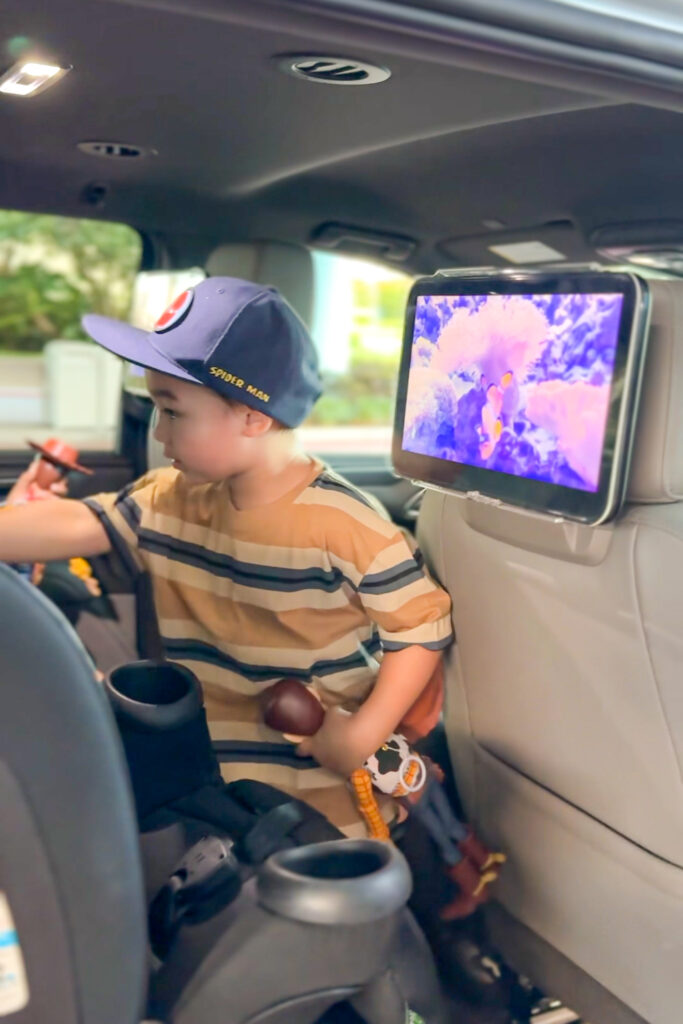 A family settling into the Minnie Van to head to the Disney parks